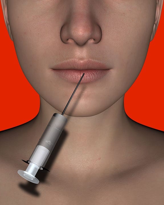 A womans face with a syringe pointing on her lips